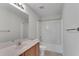 Bathroom with a toilet, vanity, and shower-tub combo with a white surround at 621 Kenridge Way # 0, Suwanee, GA 30024