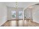 Dining room with hardwood floors and natural light at 621 Kenridge Way # 0, Suwanee, GA 30024