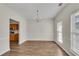Dining room featuring hardwood floors, bright lighting, and an open floorplan at 621 Kenridge Way # 0, Suwanee, GA 30024