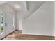 Bright foyer with hardwood floors, featuring front door and stairway at 621 Kenridge Way # 0, Suwanee, GA 30024