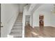 Bright entryway featuring hardwood floors, stairway and open access to other rooms at 621 Kenridge Way # 0, Suwanee, GA 30024