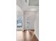 Bright foyer with hardwood floors, featuring a front door and stairway at 621 Kenridge Way # 0, Suwanee, GA 30024