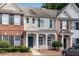Inviting townhome with manicured front yard and charming architectural details, ready for new owners at 621 Kenridge Way # 0, Suwanee, GA 30024