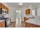 Kitchen featuring stainless appliances, hardwood floors, and open floorplan at 621 Kenridge Way # 0, Suwanee, GA 30024
