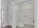 Laundry room with tile floors and a closet, ready for the installation of a washer and dryer at 621 Kenridge Way # 0, Suwanee, GA 30024