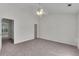 Bedroom featuring neutral carpet, gray walls, and multiple doorways at 621 Kenridge Way # 0, Suwanee, GA 30024
