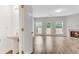 Powder room and living room with fireplace, hardwood floors, and a door leading to the backyard at 621 Kenridge Way # 0, Suwanee, GA 30024