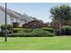 The Village at White Bluff Community entrance sign surrounded by green lawns and landscaping at 621 Kenridge Way # 0, Suwanee, GA 30024