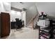 Finished basement with a functional office space under the stairs and neutral carpeting at 6217 Millstone Trl, Douglasville, GA 30135