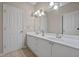 Bright bathroom with double vanity, granite counters, and updated fixtures at 6217 Millstone Trl, Douglasville, GA 30135