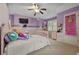Cozy bedroom with painted walls, ceiling fan, and carpeted flooring, ideal for children at 6217 Millstone Trl, Douglasville, GA 30135