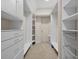 Walk-in closet with custom shelving and storage space at 6217 Millstone Trl, Douglasville, GA 30135