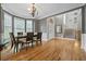 Spacious dining room with hardwood floors, a chandelier, and bay windows at 6217 Millstone Trl, Douglasville, GA 30135