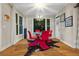 Bright dining room with modern lighting, chairs and large windows at 6217 Millstone Trl, Douglasville, GA 30135