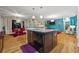 Open concept kitchen with granite island, stainless steel dishwasher, and hardwood floors, perfect for gatherings at 6217 Millstone Trl, Douglasville, GA 30135