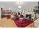 Inviting living room boasts a fireplace, stylish decor, and an open layout to the kitchen at 6217 Millstone Trl, Douglasville, GA 30135