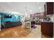 Open-concept living space with hardwood floors connecting to the kitchen at 6217 Millstone Trl, Douglasville, GA 30135