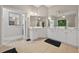 Bright and airy main bathroom featuring double sinks, large mirrors, and ample counter space at 6217 Millstone Trl, Douglasville, GA 30135