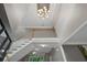 View of a staircase with a decorative light fixture at 6217 Millstone Trl, Douglasville, GA 30135
