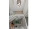 Open staircase overlooks the living room with a decorative light fixture at 6217 Millstone Trl, Douglasville, GA 30135