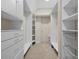 Organized walk-in closet with ample shelving, drawers, and storage space for clothes and accessories at 6217 Millstone Trl, Douglasville, GA 30135