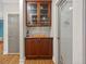 Butler's pantry boasts upper display cabinets, base cabinets, counter, and pantry door at 6217 Millstone Trl, Douglasville, GA 30135