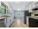 Bright kitchen features stainless steel appliances, wood flooring, and ample counter space at 6650 Bobby John Rd, Atlanta, GA 30349