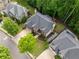 Aerial view of the property, showcasing the yard, landscaping, and neighboring homes at 790 Sienna Dr, Cumming, GA 30040