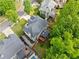Aerial view of the home, showcasing the expansive yard and mature trees at 790 Sienna Dr, Cumming, GA 30040