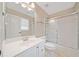 Bright bathroom features a white vanity, enclosed shower/tub, and a neutral color palette for a clean, modern look at 790 Sienna Dr, Cumming, GA 30040