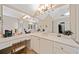 A bathroom with dual sinks, large mirrors, and vanity at 790 Sienna Dr, Cumming, GA 30040