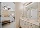 This bathroom features a marble countertop sink and is attached to a bedroom with a cozy bed at 790 Sienna Dr, Cumming, GA 30040