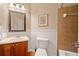 An interior bathroom with tile shower and tile flooring and white commode at 790 Sienna Dr, Cumming, GA 30040