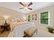 Inviting bedroom with natural light, neutral tones, and a bed with a bench, creating a cozy and calming space at 790 Sienna Dr, Cumming, GA 30040