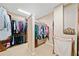 A closet with rods, hanging clothes, and shelves at 790 Sienna Dr, Cumming, GA 30040