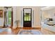 Inviting foyer with hardwood floors, decorative rug and front door with sidelights at 790 Sienna Dr, Cumming, GA 30040