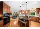 Modern kitchen with granite countertops, wood cabinets, and an eat-in breakfast nook at 790 Sienna Dr, Cumming, GA 30040