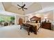 A main bedroom with carpet, natural light, and a ceiling fan at 790 Sienna Dr, Cumming, GA 30040