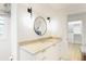 Bathroom featuring a round mirror and granite counters at 1 Habersham Nw Way, Atlanta, GA 30305