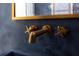 Modern bathroom features brushed gold fixtures and a dark stone sink at 1 Habersham Nw Way, Atlanta, GA 30305