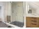 Updated bathroom featuring a glass shower and wood cabinetry with black hardware at 1 Habersham Nw Way, Atlanta, GA 30305