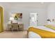 Bright bedroom with desk, stylish decor, and a doorway to a bathroom beyond at 1 Habersham Nw Way, Atlanta, GA 30305