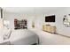 Spacious bedroom with a decorative record collection, TV, and lots of natural light at 1 Habersham Nw Way, Atlanta, GA 30305