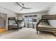 Spacious bedroom with hardwood floors, bunk beds, and a ceiling fan at 1 Habersham Nw Way, Atlanta, GA 30305