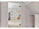 Shared bedroom leading to bath featuring bunk beds, ceiling fan and adjacent closet at 1 Habersham Nw Way, Atlanta, GA 30305