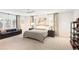 Large bedroom with many windows, natural light, neutral colors, a ceiling fan, and seating at 1 Habersham Nw Way, Atlanta, GA 30305