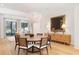 Chic dining room with stylish chandelier, hardwood floors, and a modern sideboard at 1 Habersham Nw Way, Atlanta, GA 30305