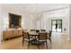 Bright dining area showcasing a unique chandelier and modern decor at 1 Habersham Nw Way, Atlanta, GA 30305