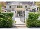 The property features a stone front gate with decorative accents and lush greenery at 1 Habersham Nw Way, Atlanta, GA 30305