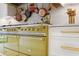 Close up of a stainless range and hood with olive green accents, next to marble counter tops at 1 Habersham Nw Way, Atlanta, GA 30305